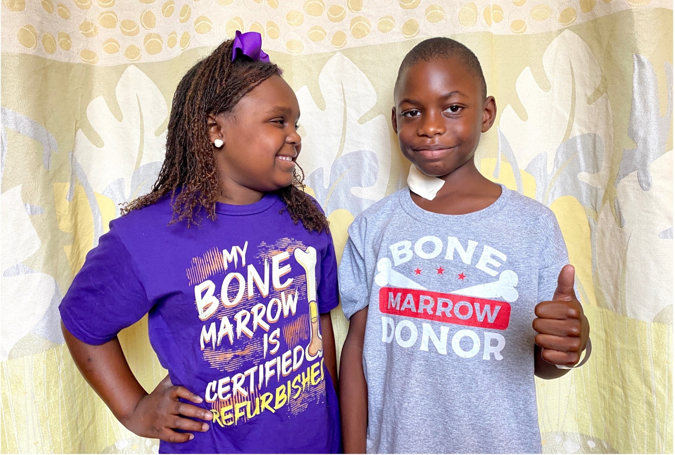 Girl and boy standing together smiling